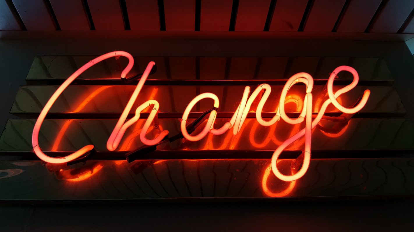 Neon sign that says Change, for changing vendors